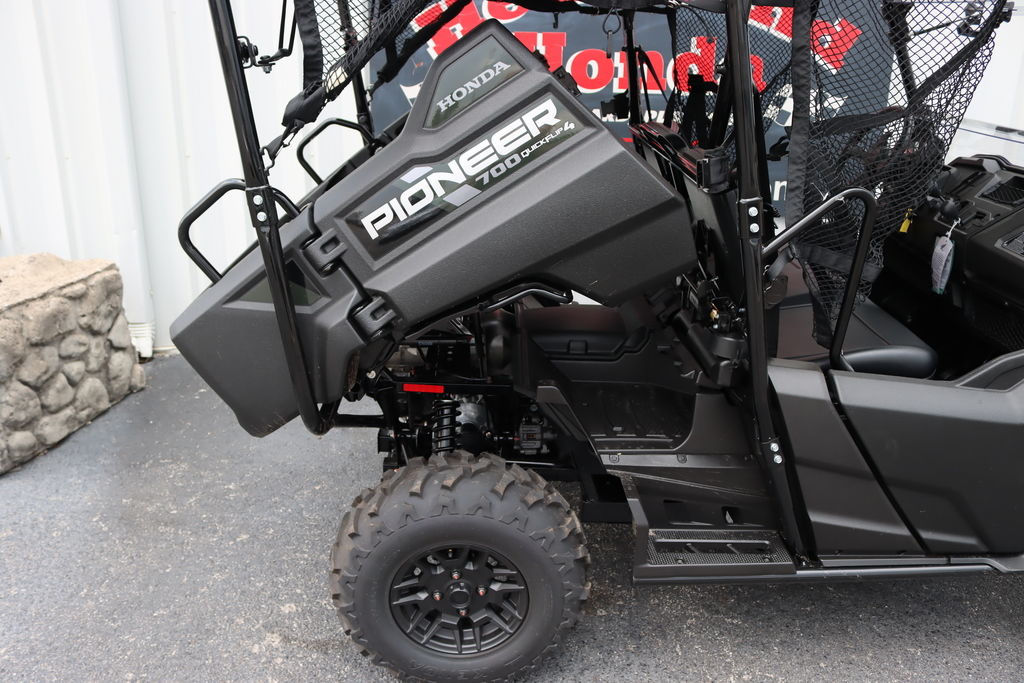 Honda Pioneer 700-4 Deluxe rear seats folded into the cargo bed
