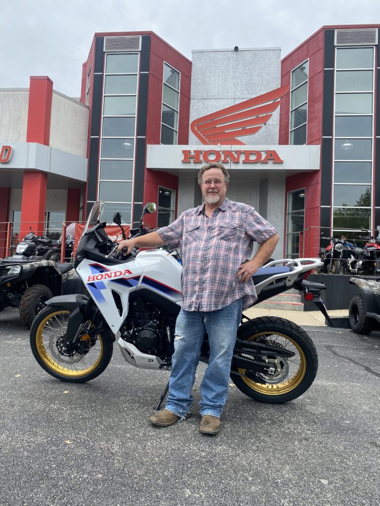 Robert Fox with the Honda Transalp adventure motorcycle he traded for at Heartland Honda.