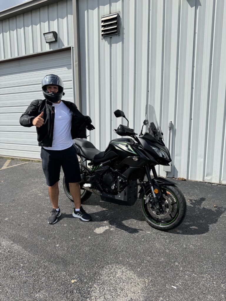 Jose Reyes with his Kawasaki Versys 650 adventure motorcycle at Heartland Honda in Northwest Arkansas.